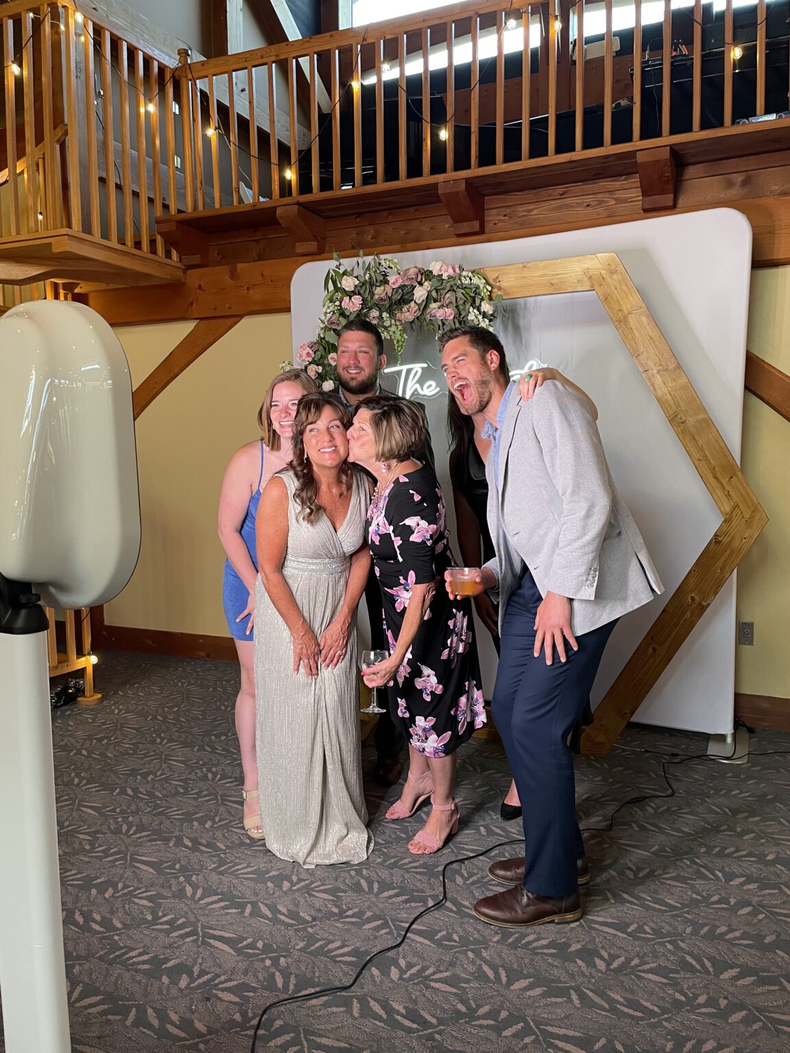 A group of people posing for a photo booth.